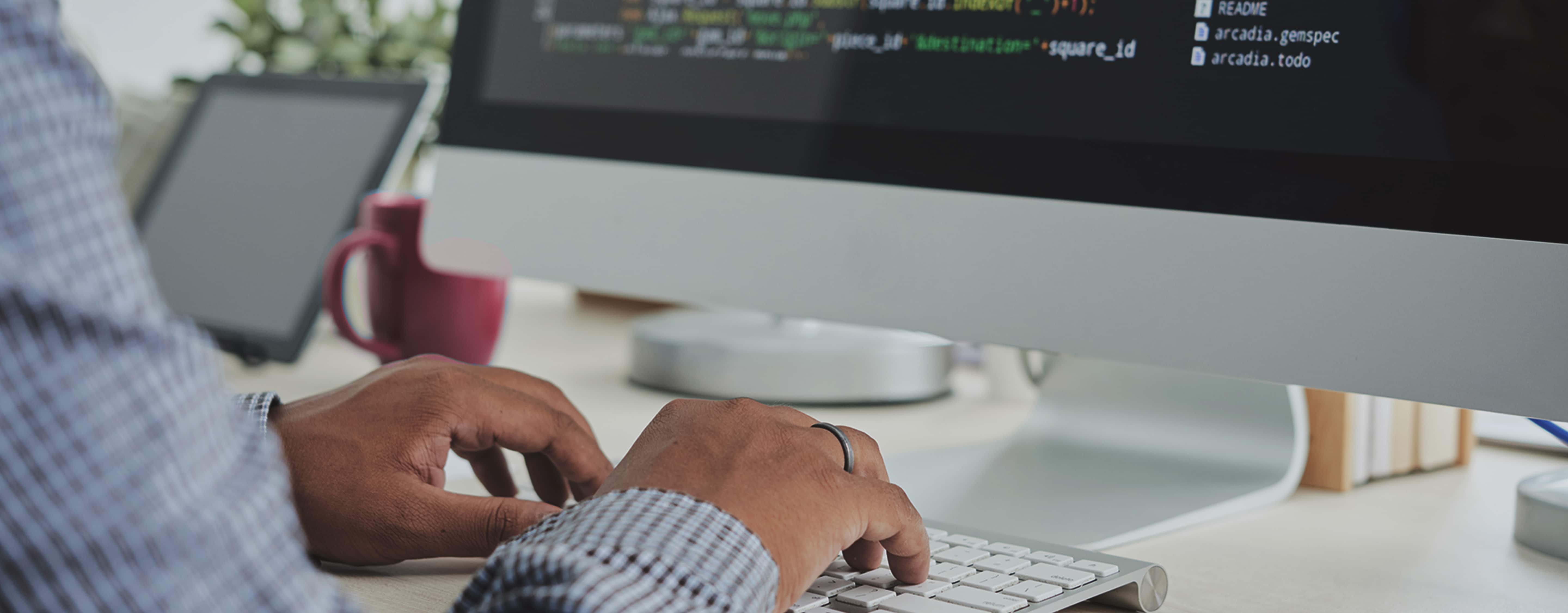 Person coding on a computer