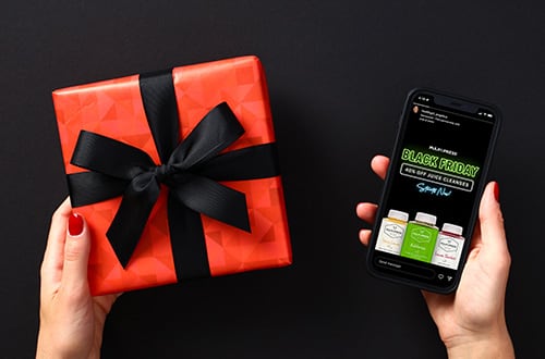 Person holding gift and phone