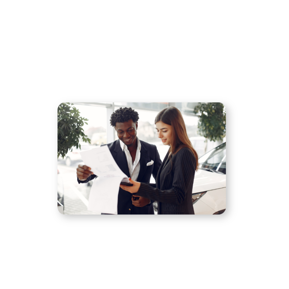 Powerful CDP Solutions for Personalized Customer Experiences hero in colour two people reviewing a contract with a car in the background