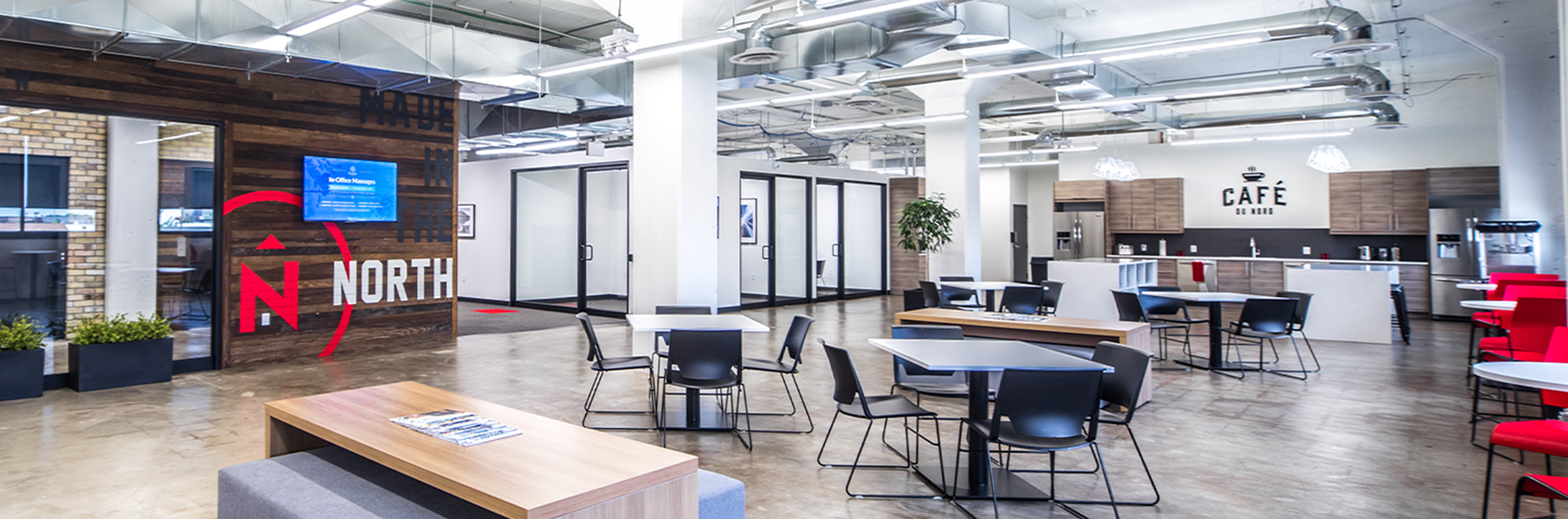 Northern office with tables, chairs, and kitchen