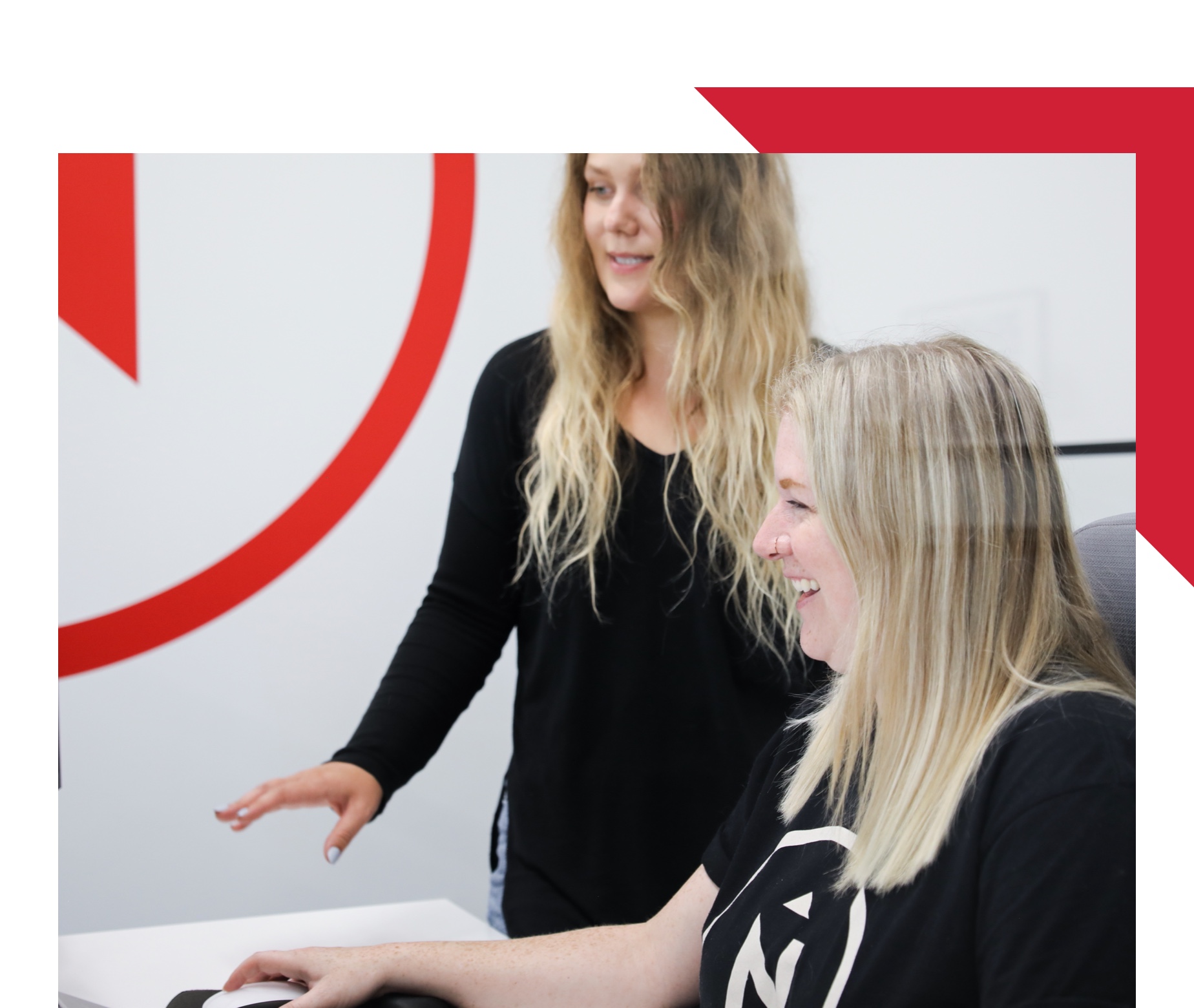 employees collaborating on a computer