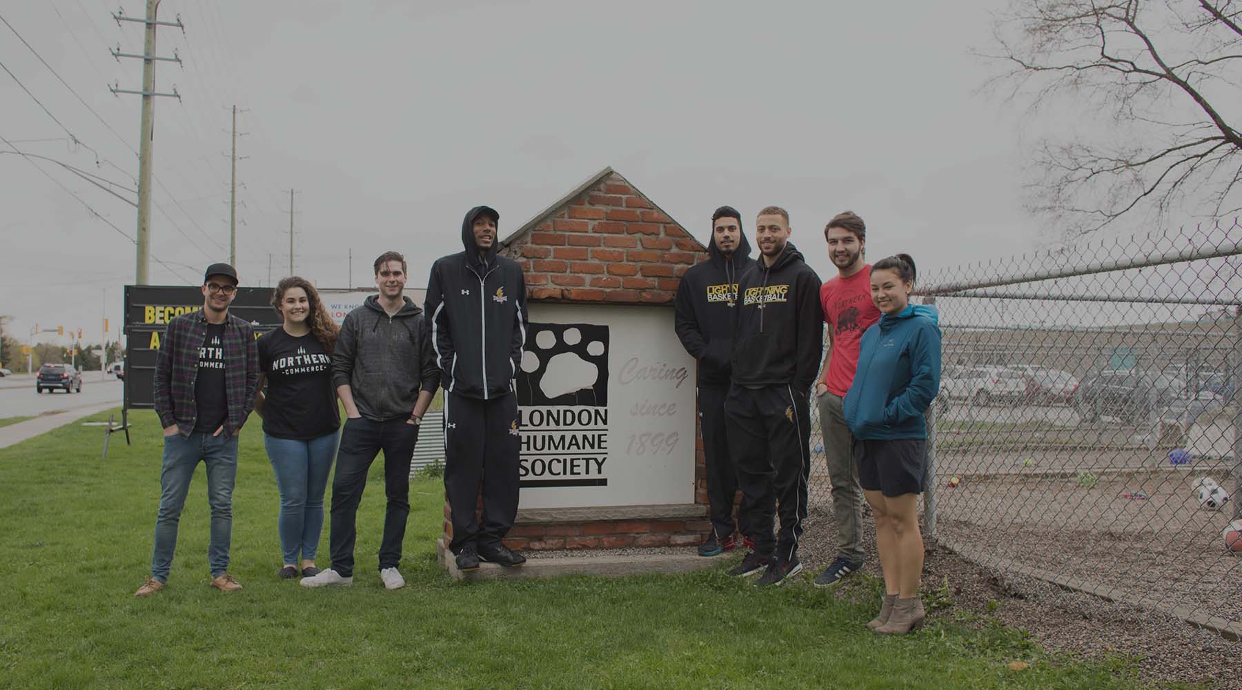 Northern team members in front of London Humane Society sign