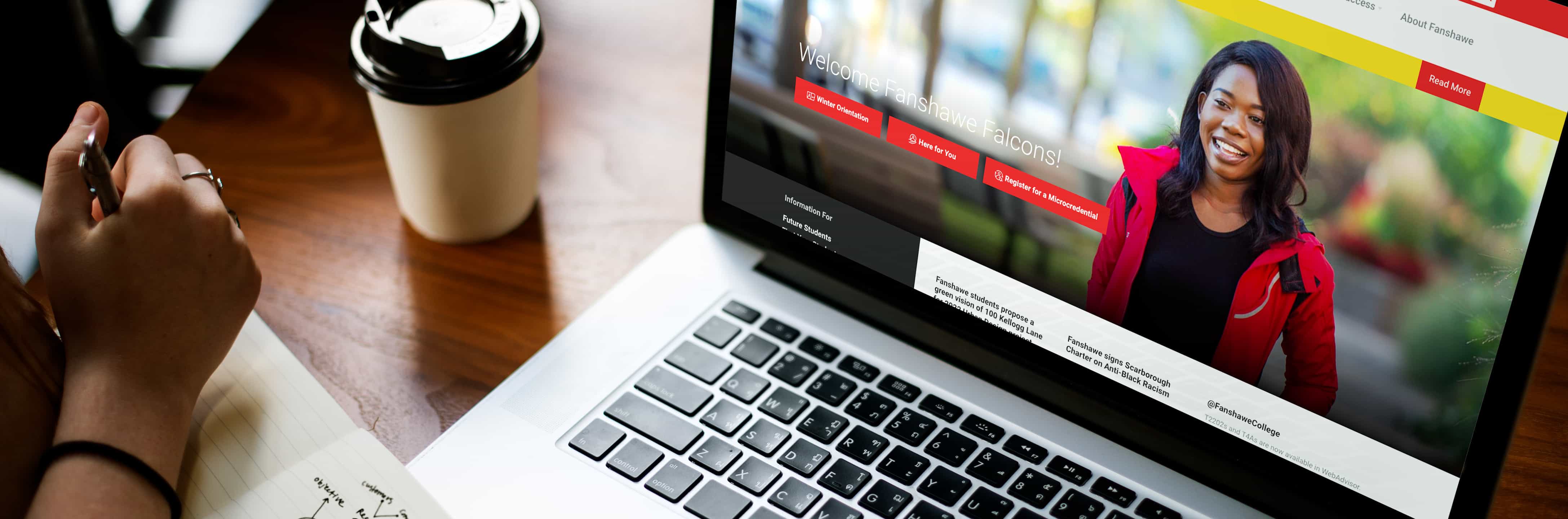 Girl on laptop looking at Fanshawe College website.
