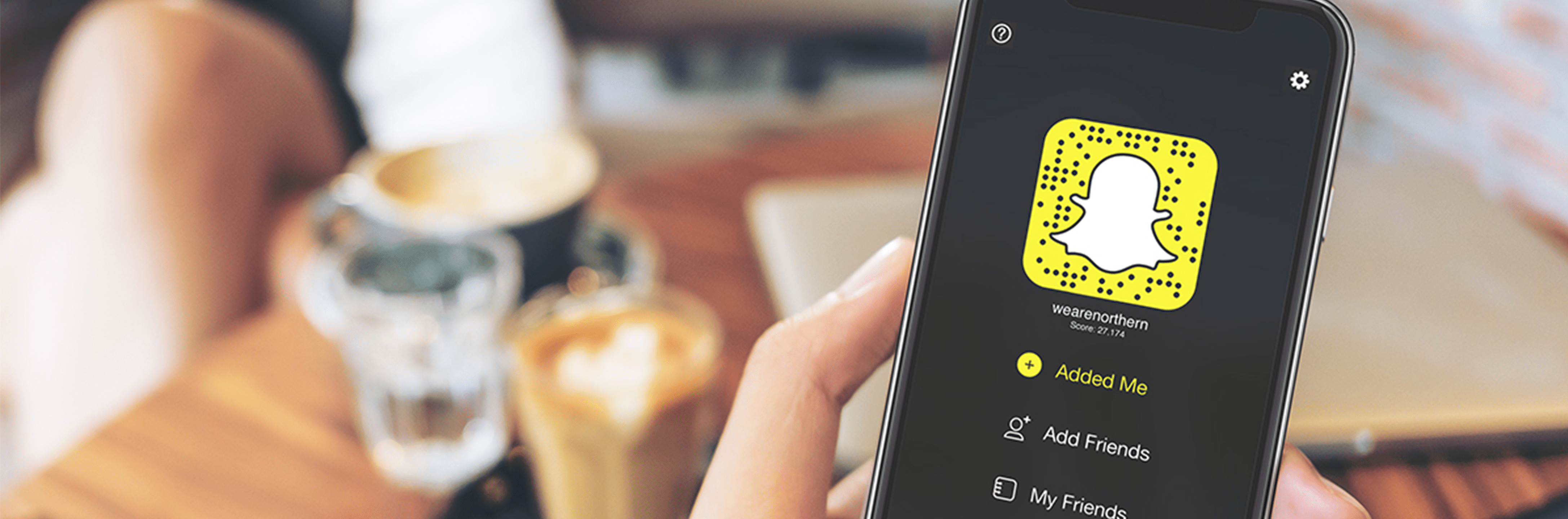 Snapchat app on phone in a hand