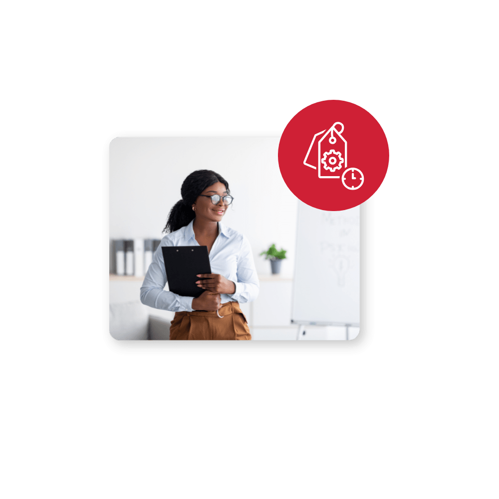 Woman with glasses holding laptop with tag logo in top right corner