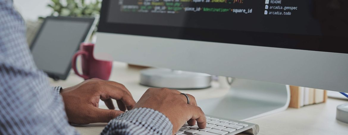 Person coding on a computer