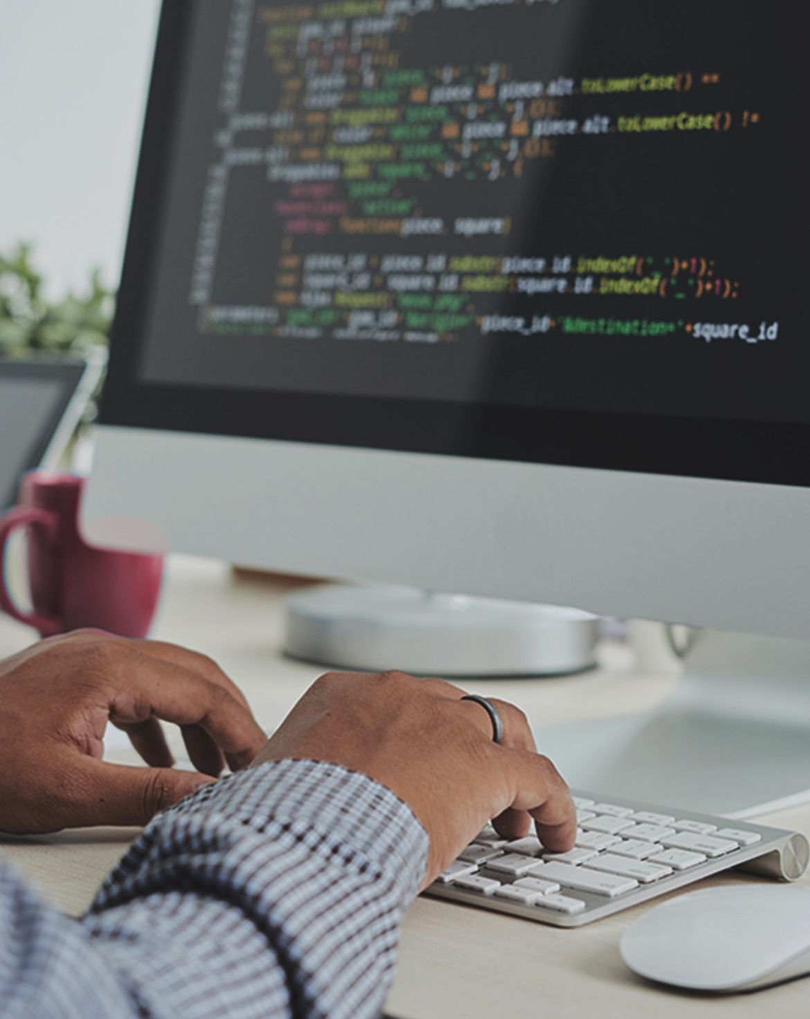 Person coding on a computer