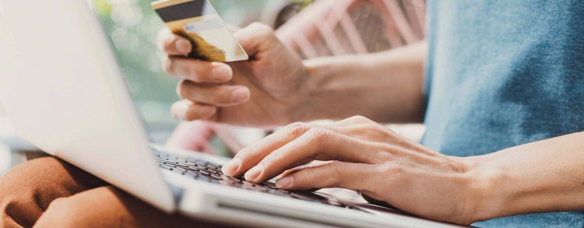 Person using laptop to shop online.