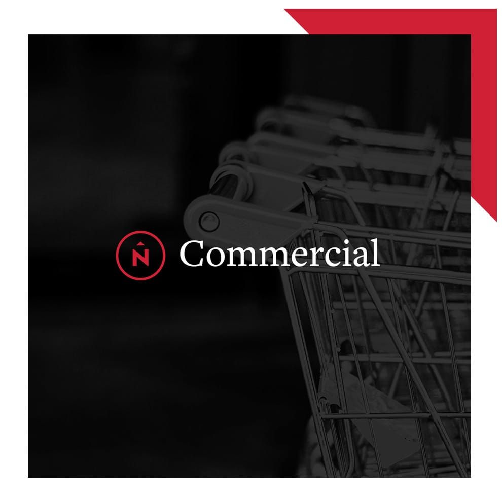 Northern Commercial logo in front of a black and white photo of shopping carts