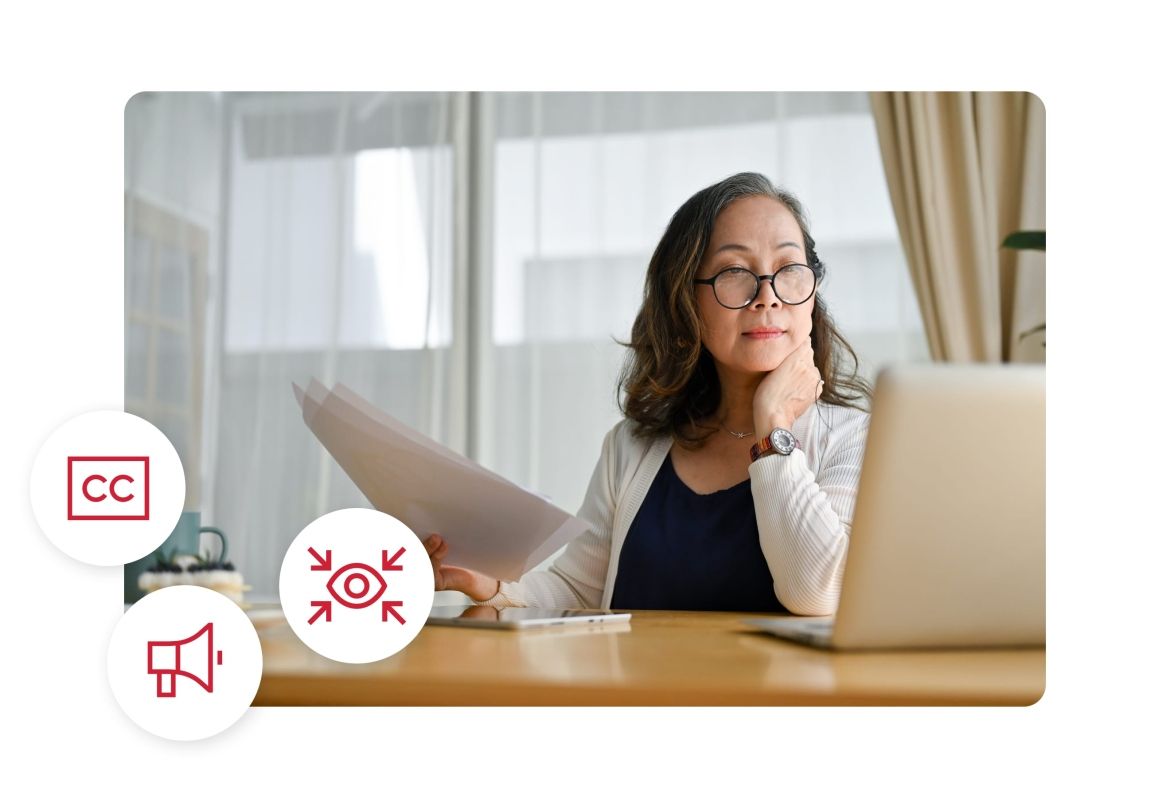 UX Solutions- Accessibility Woman with glasses looking at her laptop
