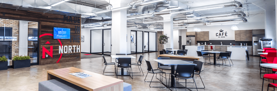 Northern office with tables, chairs, and kitchen