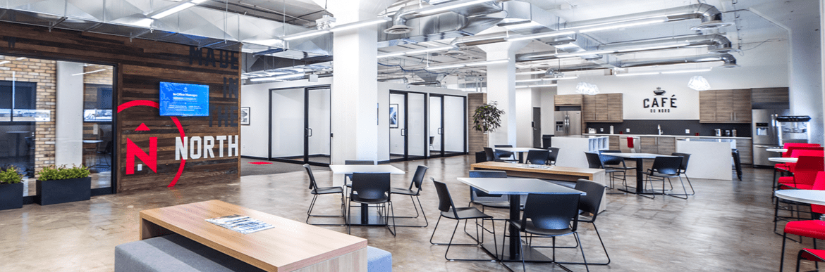 Northern office with tables, chairs, and kitchen