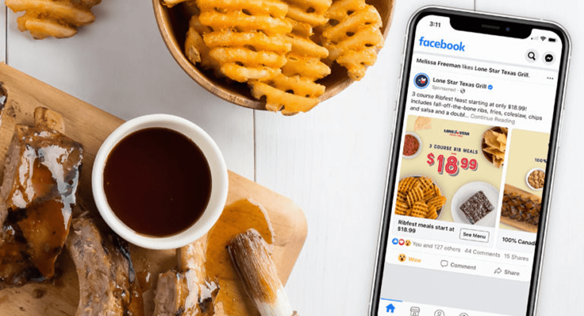 Facebook ad for Lonestar Texas Grill on phone on table with food