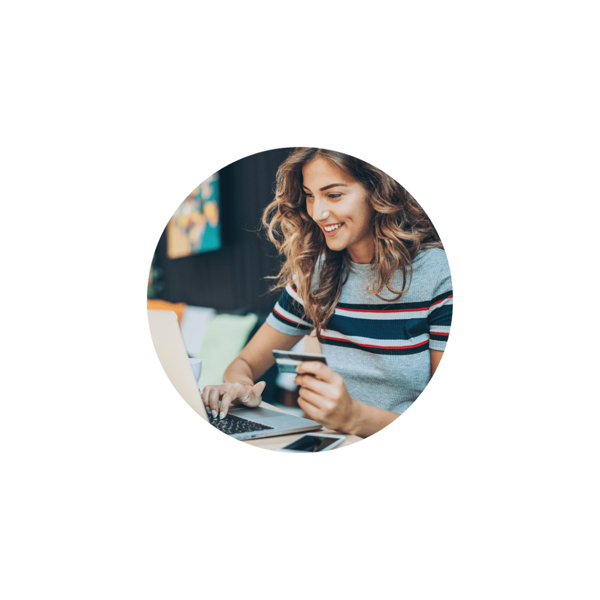 Girl using laptop with bank card in hand while using a computer