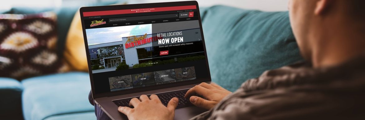 Person looking at Royal Distributing website on laptop