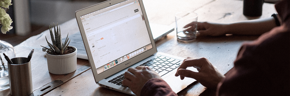 Person typing on laptop