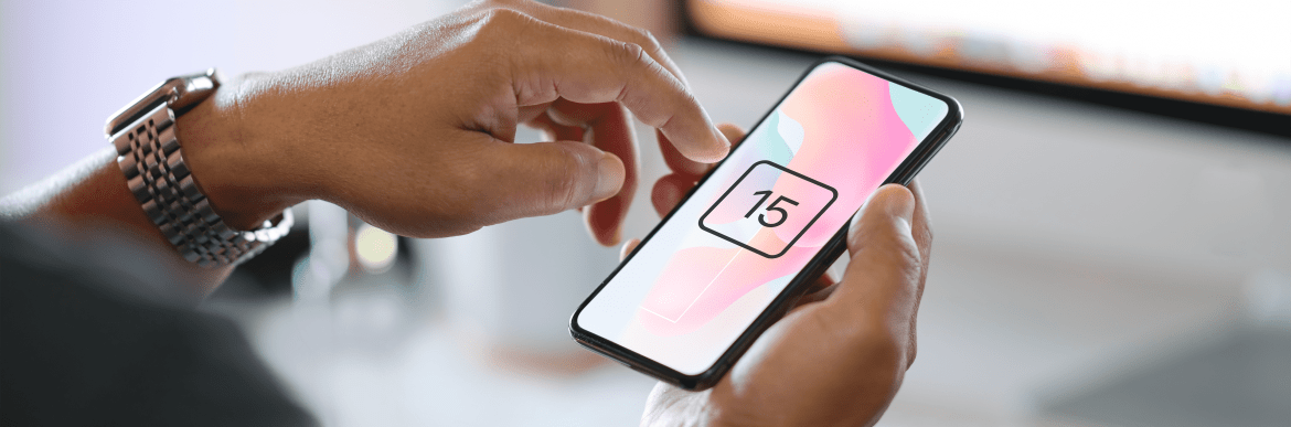 Phone displaying number fifteen in someone's hands