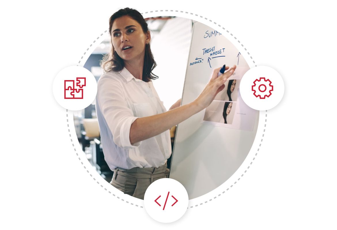 Woman highlighting graphic on a whiteboard