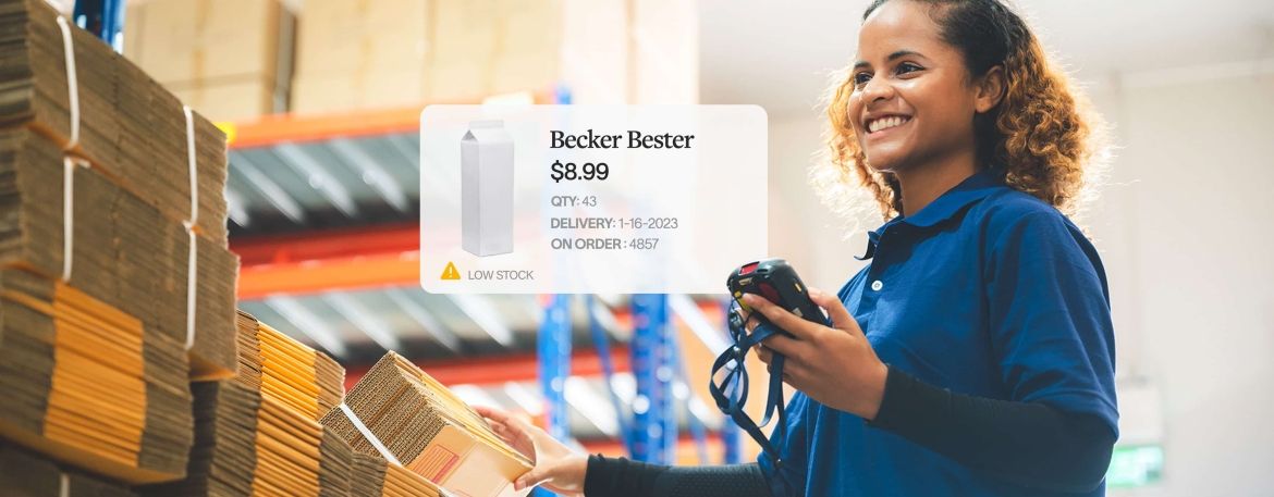 Image of inventory warehouse worker scanning packaging.