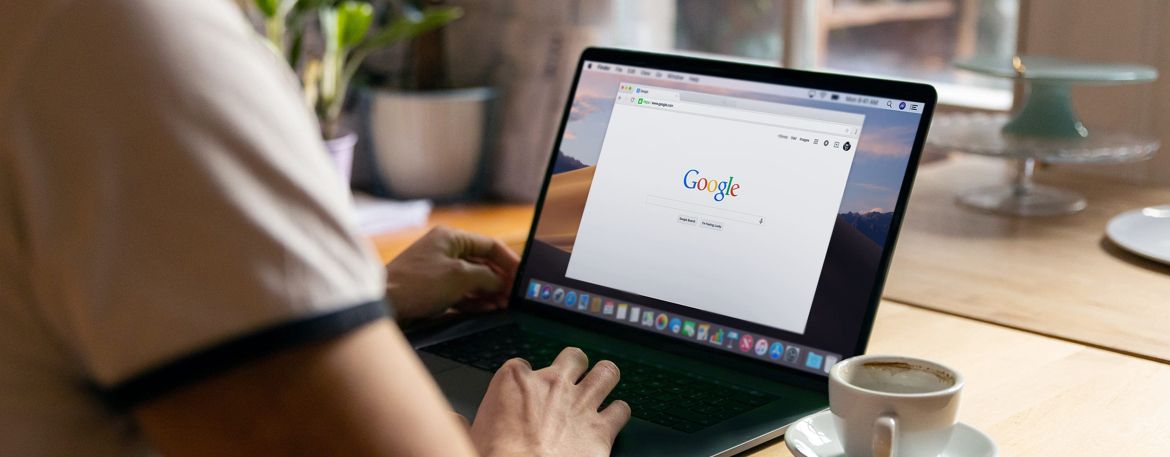 person working on a laptop with google open in browser