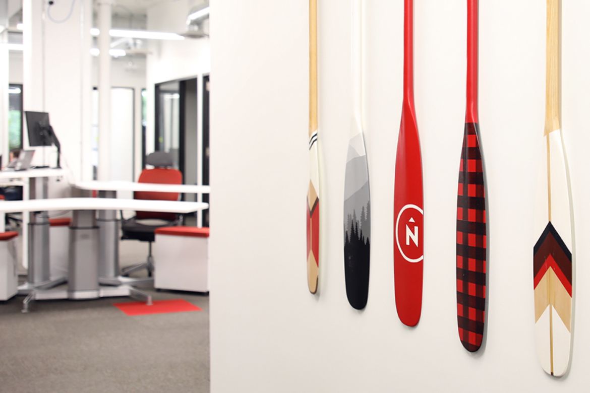 Northern office wall with custom canoe paddles