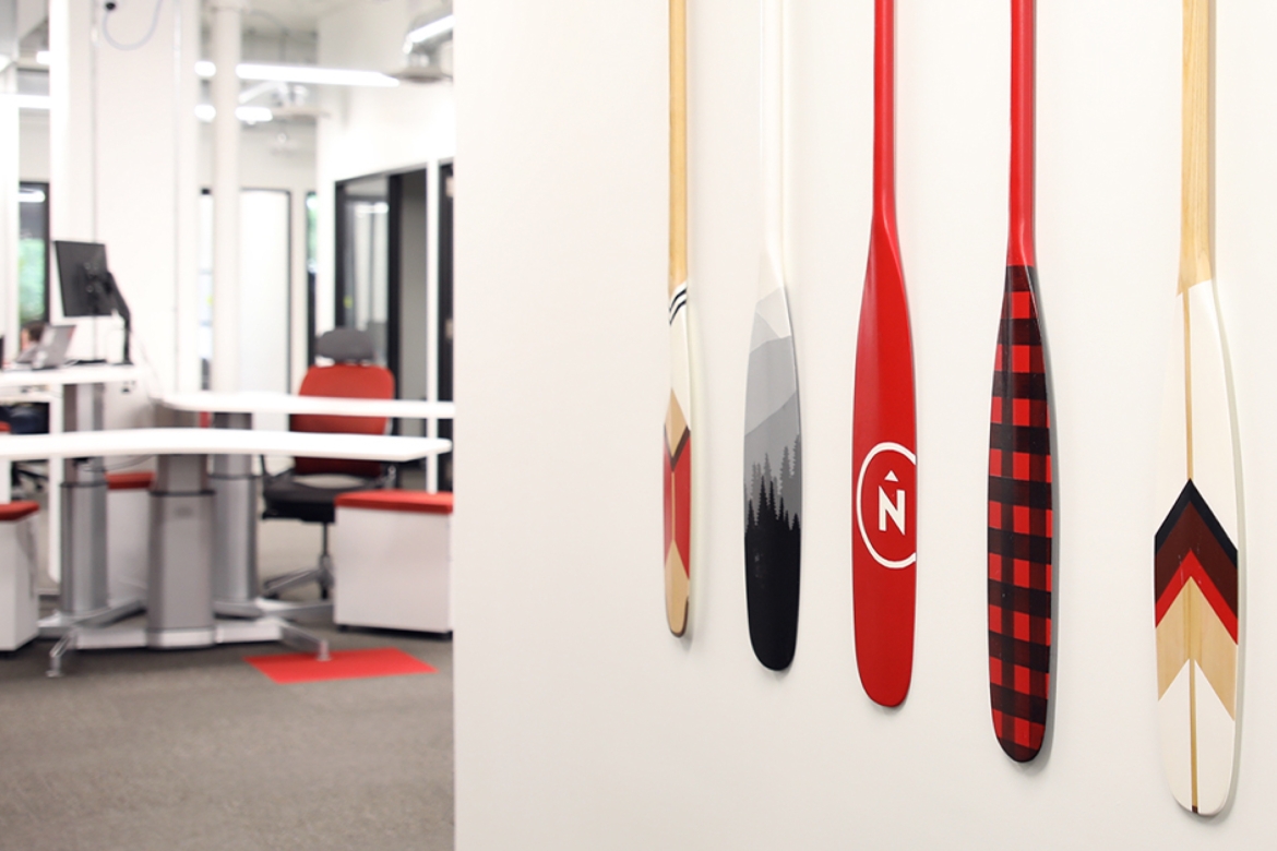 Northern office wall with custom canoe paddles