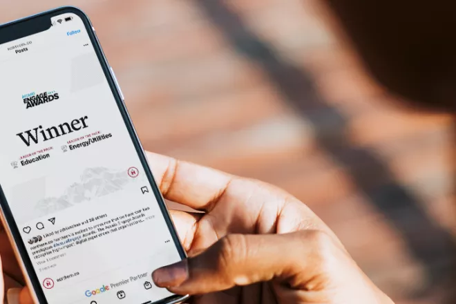 Acquia Engage Award on a phone screen