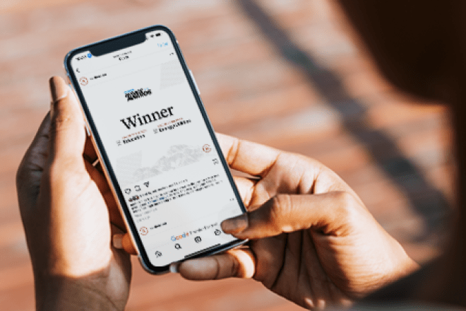 Acquia Engage Award on a phone screen