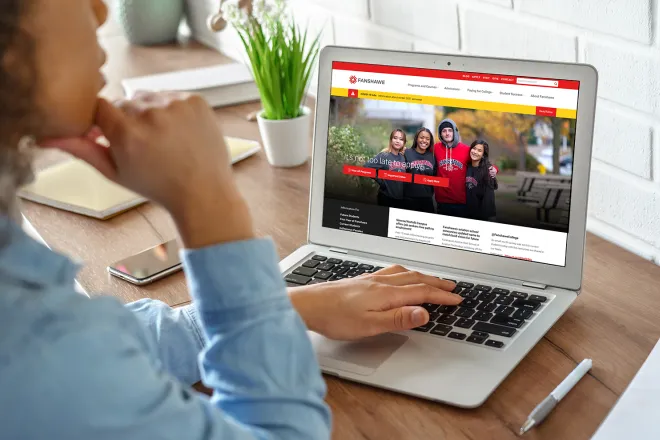 Girl on laptop looking at Fanshawe College website