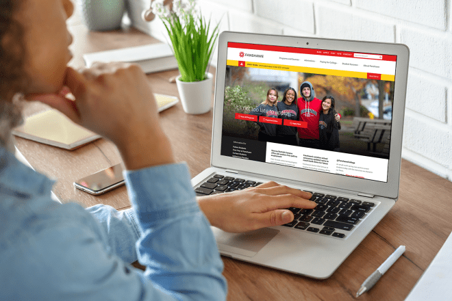 Girl on laptop looking at Fanshawe College website