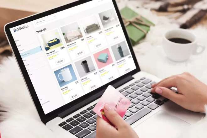 Woman shopping on laptop