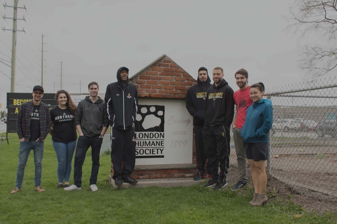 Northern team members in front of London Humane Society sign