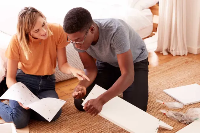 Couple on the floor discussing materials