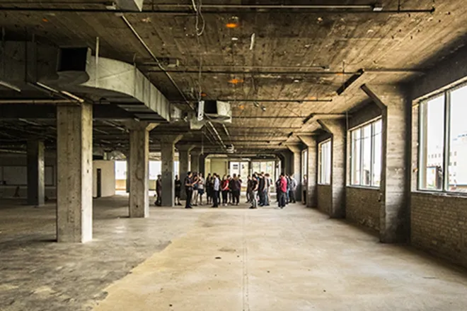 New Northern office, empty cement warehouse space