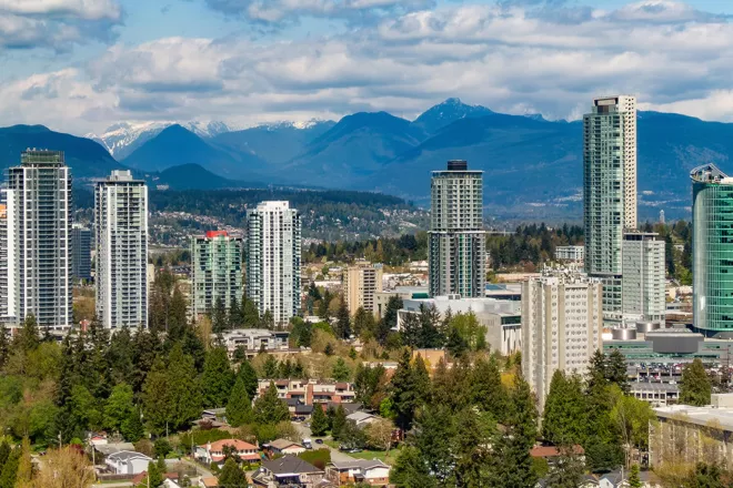 City of Surrey skyscrapers with mountain range in as backdrop