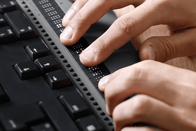 Hands typing on keyboard