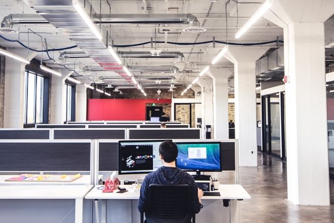 Northern office with desks and person working