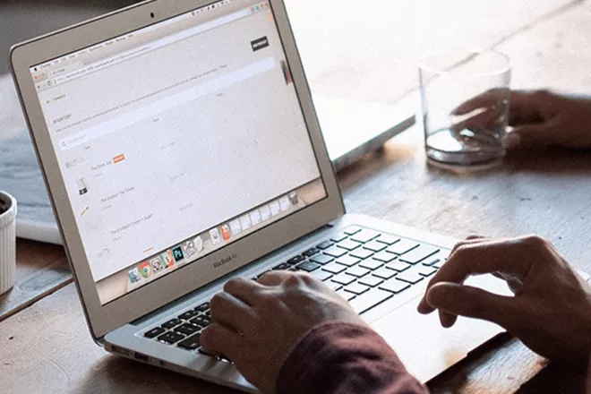 Person typing on laptop