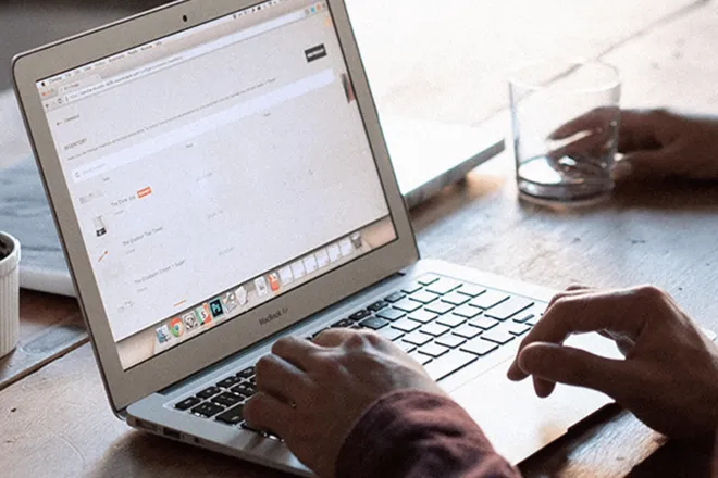 Person typing on laptop