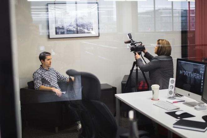 Man being filmed in office