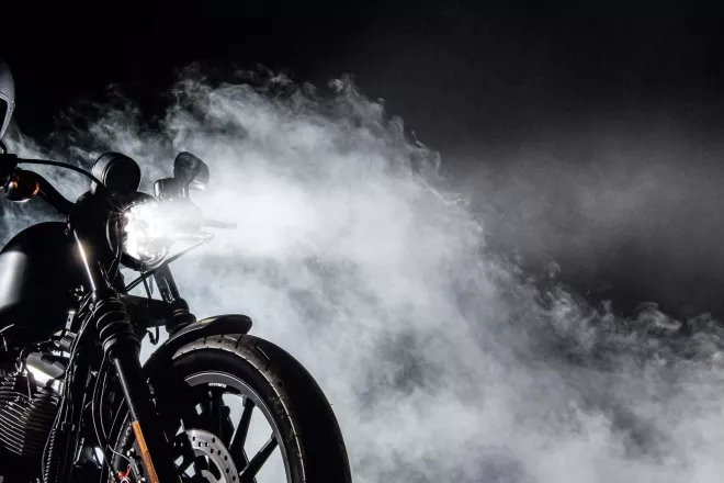 person on motorcycle with smokey background