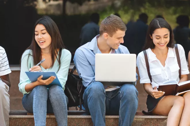Students reading their textbooks.