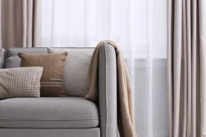 Beige couch in a living room.