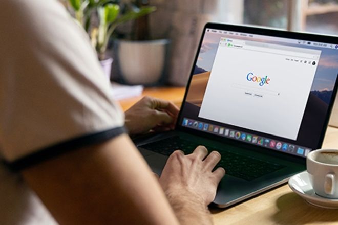 person working on a laptop with google open in browser