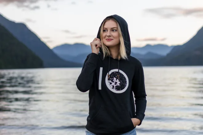 Tentree sweater model with lake background
