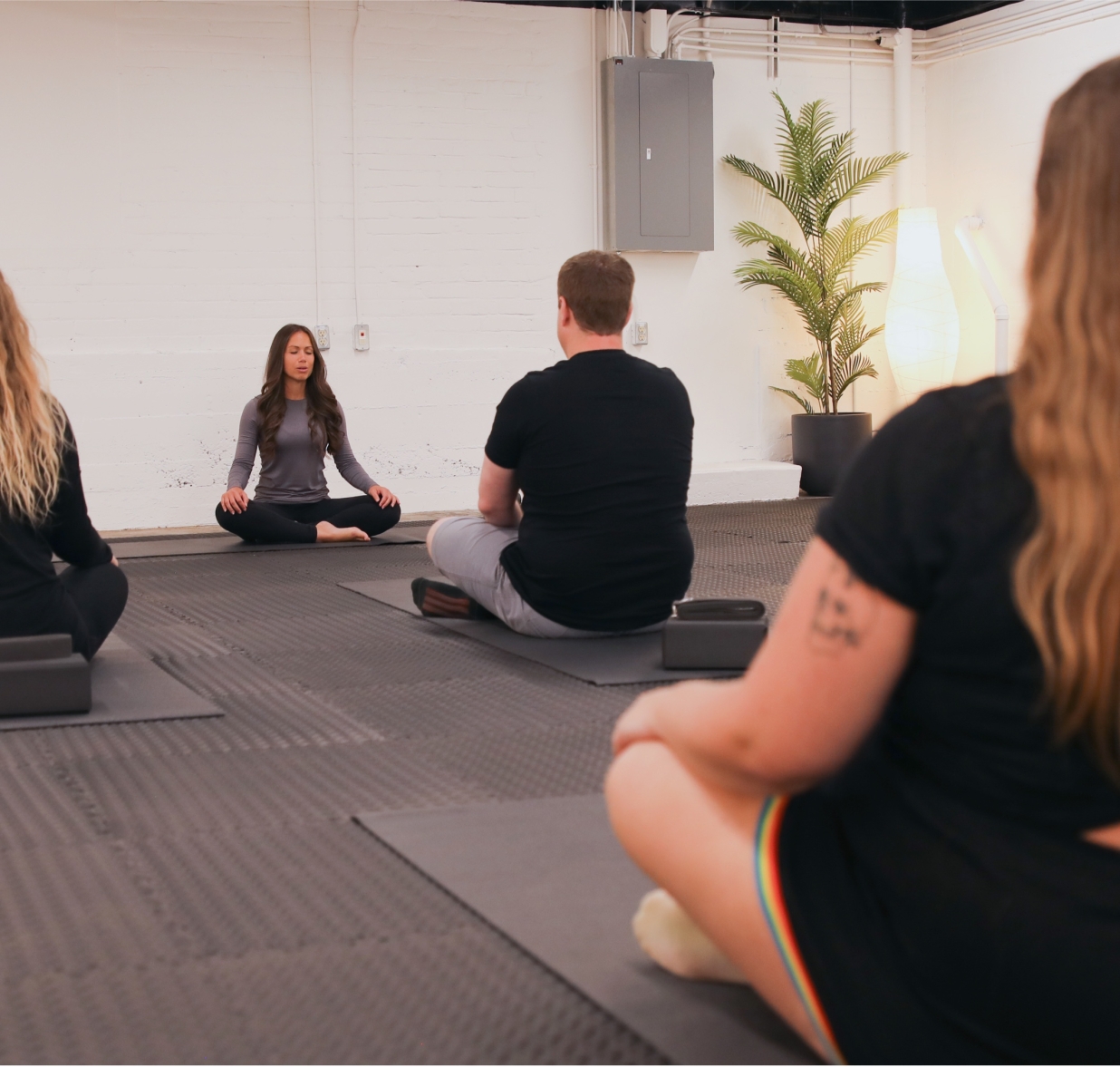 Team doing meditation in wellness room