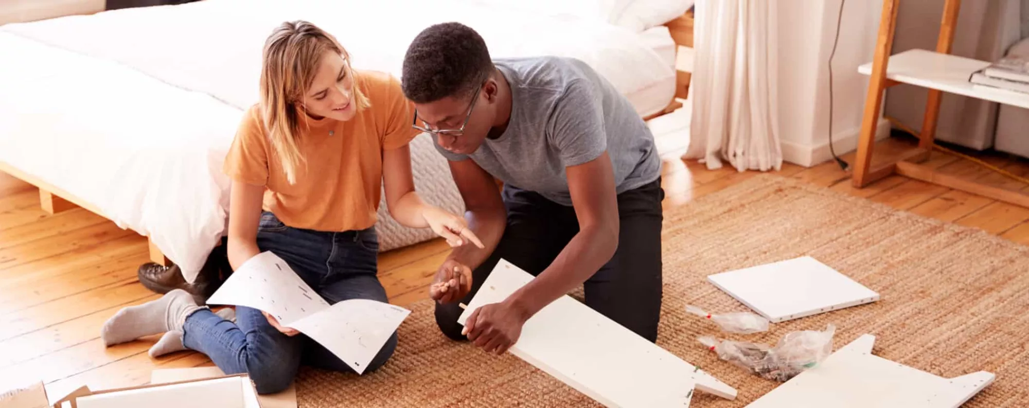 Couple on the floor discussing materials