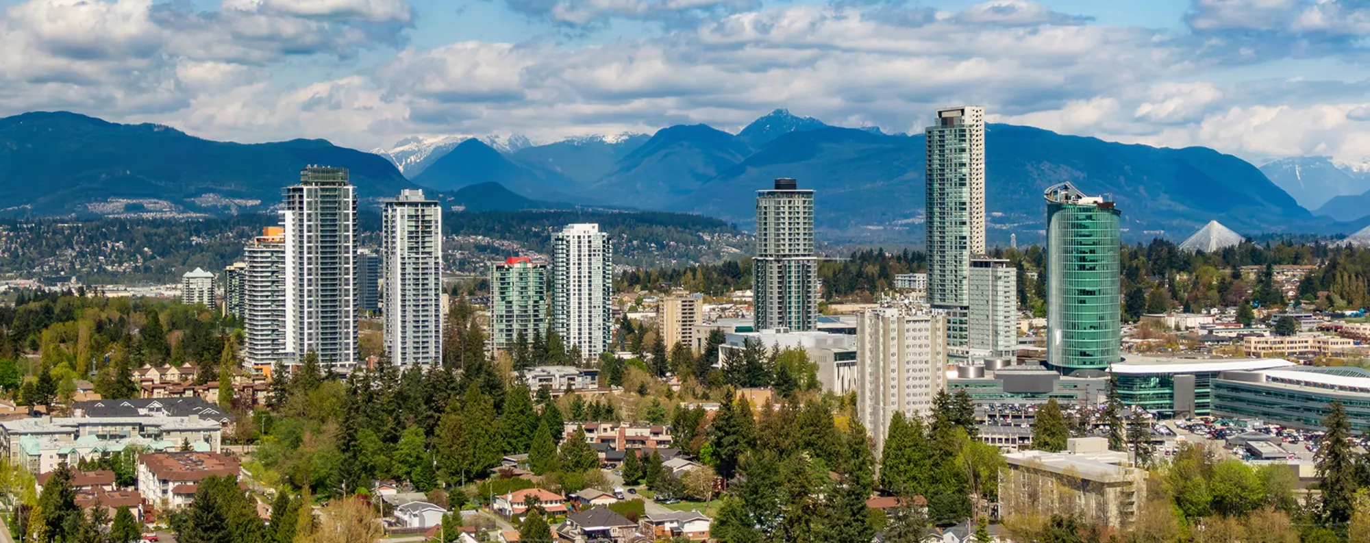 City of Surrey skyscrapers with mountain range in as backdrop