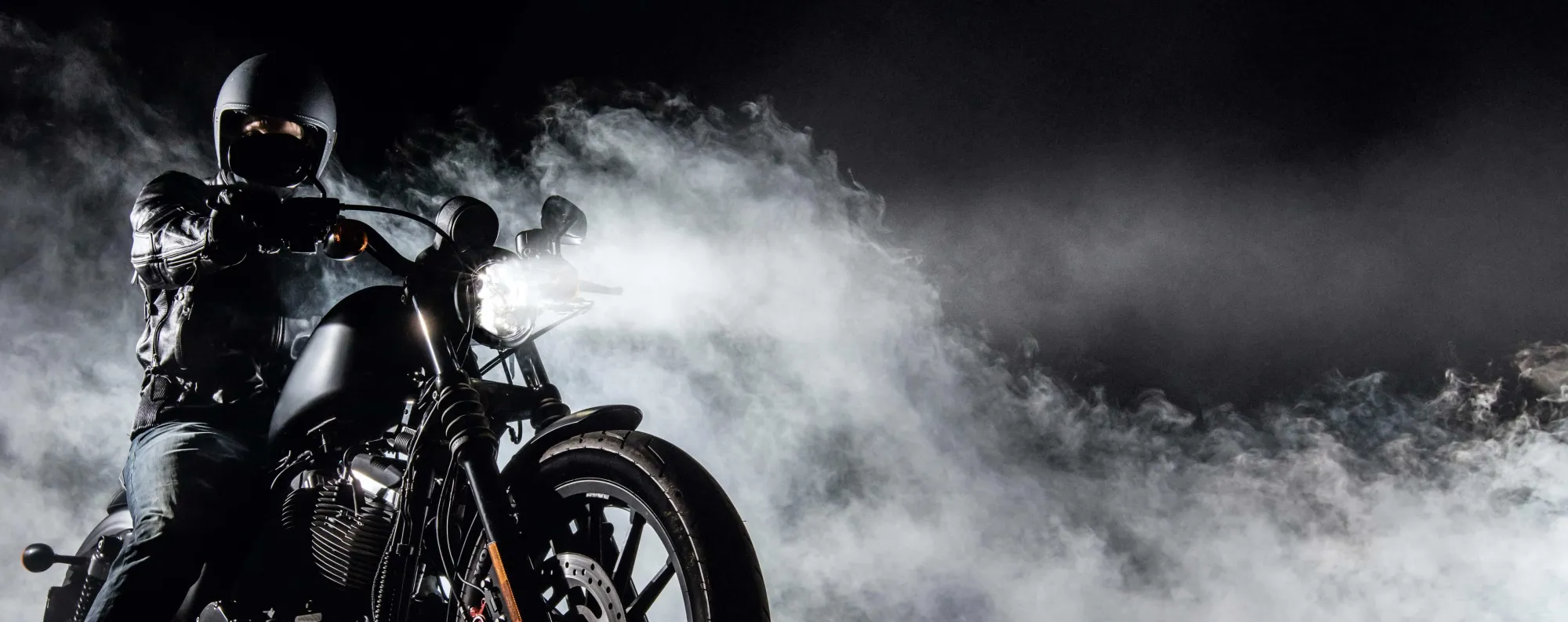 person on motorcycle with smokey background