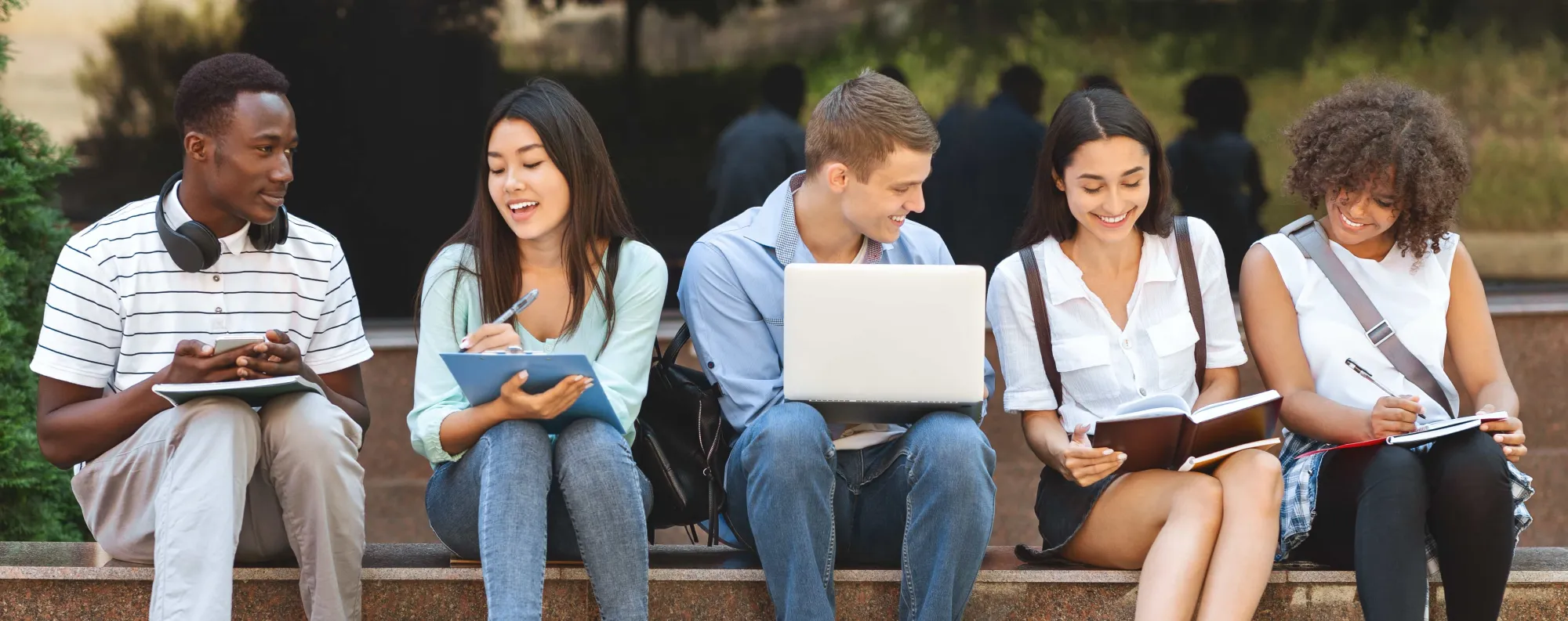 Students reading their textbooks.